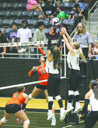 Bonnie Bowers (#8) and Kayden Lidy (#11) defend at the net in the district match at Kaufman High School between Kaufman and Kemp on Sept. 15. Photo by Blaine Clamon