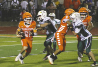 Riley Roberson (#21) rushes during Kemp’s homecoming game versus Founders Classical on Friday, Oct. 2. Photo by Blaine Clamon