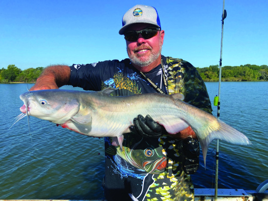 Lake Tawakoni guide Tony Pennebaker shows off one of many blue catfish he landed on a trip last week. The ‘big fish’ fall bite is getting underway. Photo by Luke Clayton