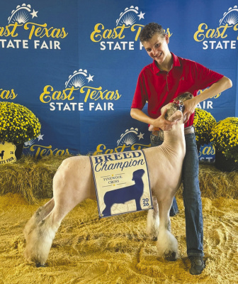 Rowdy Smith joins Kaufman County 4-H students at the Sept. 11-15 East Texas Junior Livestock Show, where he received first place and Fine Wool Cross Breed Champion in the Market Lamb Show, also winning his Southdown class and being named Reserve Breed Champion Southdown. Courtesy Photo/Meagan Smith