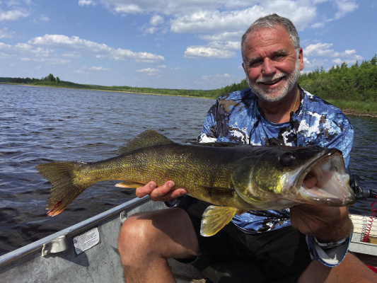 Jeff Rice shows off one of many big walleye landed on the last trip. Photo by Luke Clayton