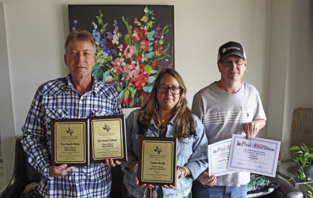 Van Zandt Newspapers L.L.C. recently received a number of awards at the 99th Annual North and East Texas Press Association (NETPA) Convention in Pilot Point. Shown with the awards were left to right, Van Zandt Newspapers L.L.C. staff members Tim Ball, Graphic Designer; Amanda Greene, Office Manager/Layout; and Brian Edwards, Operations Manager. Van Zandt Newspapers L.L.C. publishes the Van Zandt News, the Canton Herald, the Terrell Tribune, and the Kaufman Herald. Photo by David Barber