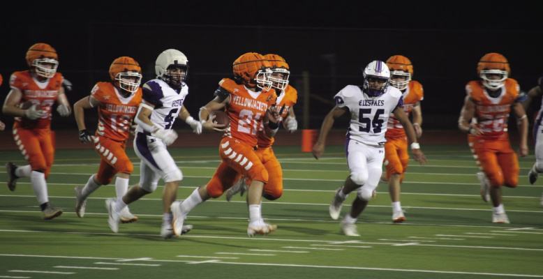 Photo by Russell Slaton Riley Roberson of Kemp (center) sweeps toward the sideline during an Aug. 28 punt return, following Roberson regaining the ball after initially fumbling the attempt. He ran for 17 yards in the game, also leading his team with 26 total yards received on offense.