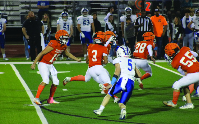 Nathan Dunn (#15) hands the ball off to Zaki Brown (#3) in Kemp's home district game versus Quinlan- Ford on November 7th. Photos by Blaine Clamon