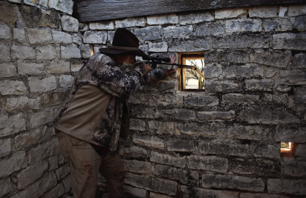 A deer stand can be anything from a board nailed in a tree to an old stone structure with shooting ports. Larry Weishuhn is hunting from an old long abandoned Calvary outpost in West Texas. Photo by Luke Clayton