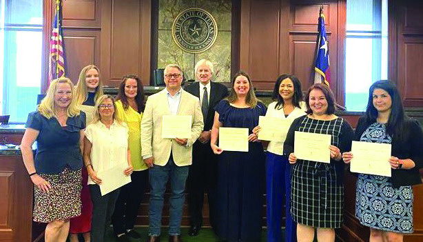 Pictured from left to right: Lauri Dodd, Haley McGee, Lezlie Carvell, Barbi Angott, Beau Winkler, Judge Hall, Julie Tanner, an unnamed volunteer, Nereida Garcia Price and Nevine Carlson are sworn in as Lone Star CASA volunteers July 2 in Rockwall. Courtesy photo