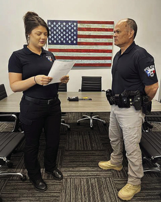 City of Kemp’s Myranda Gilmore (from left) welcomes new Chief of Police Curtis Kaloi. Kaloi’s new position for the city became effective May 27. Photo courtesy of City of Kemp