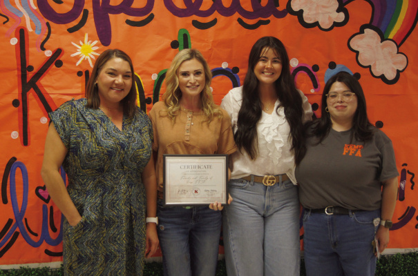 Kemp ISD Executive Director of Extracurricular Activities Administration Kelsey Whiteley (left) presents Friends and Family of FFA President Brooke Lacy (second from left) and Madison Steward with the Community Certificate of Recognition during the Nov. 17 school board meeting. Photos by Amber Curtis