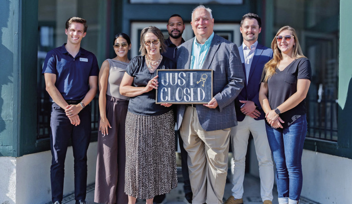 Members of the Terrell Economic Development Corporation and Terrell Chamber of Commerce celebrate closing on the Brin Opera House as the future headquarters of both organizations on July 22. Photo courtesy of Terrell Economic Development Corporation
