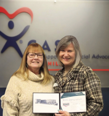 Chris Hoffmeyer (left) is presented with the Hometown Hero Award by Diane Stegall (right). Courtesy photo