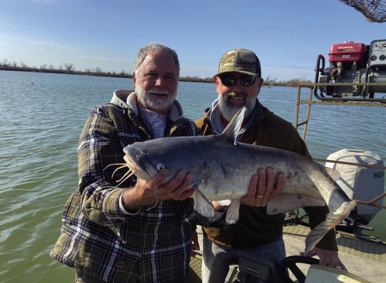 Donny Rice shows off one of many blue catfish caught recently on noodles (jug lines) while fishing in Donny’s lake. Photo by Luke Clayton