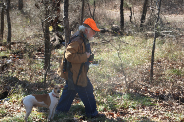 Donny Lynch with one of his prized squirrel dogs. Photo by Luke Clayton