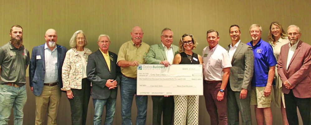 The Metro East Division of the Dallas Builders Association presents a $110,435 check to Lone Star CASA. Courtesy Photo