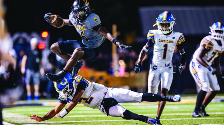 Crandall Pirate LaMahjae Collins makes a leap over a Corsicana Tigers defender during their 38-30 win on Friday, Sept. 25 at home. Photo courtesy of Jason Bowie