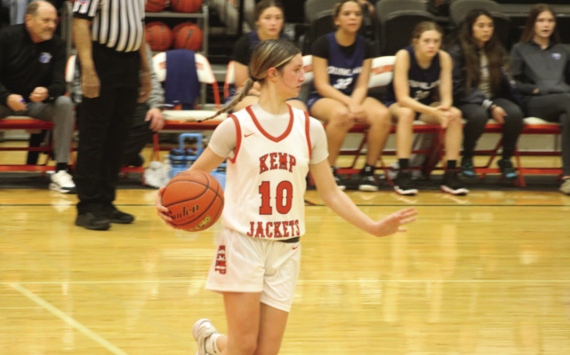 Rainey Carney (No. 10) dribbles with the ball during Kemp’s Dec. 2 home game against Quinlan Ford. Photo by Blaine Clamon