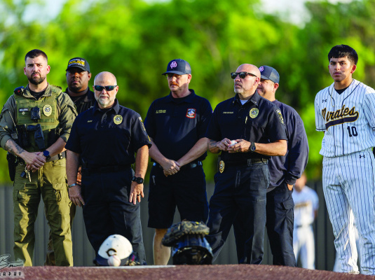 The Crandall Pirates baseball team honors First Responders before their game against the Kaufman Lions on Friday, April 10. Photo courtesy of Jason Bowie