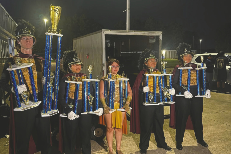 The Kaufman High School Lion Band put on their very best show of the year and came home with a lot of hardware. The Lion Band won Outstanding Percussion, Outstanding Color Guard, Outstanding Music and Outstanding Visuals in both preliminaries and finals. After all their hard work, the Lion Band was named Overall Grand Champions. Photo courtesy of Kaufman Lion Band Boosters