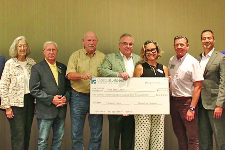 The Metro East Division of the Dallas Builders Association presents a $110,435 check to Lone Star CASA. Courtesy Photo