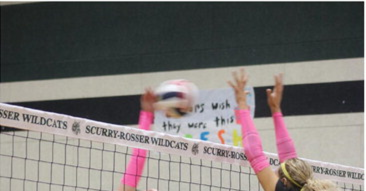 Photo by Blaine Clamon Bree Tinney (#14) jumps to block a spike from Brynleigh Mead (#2) during the district volleyball match between Malakoff and Scurry-Rosser on Thursday, Oct. 1.